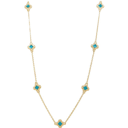 A enamel clover station necklace with simulated diamonds displayed on a neutral white background.