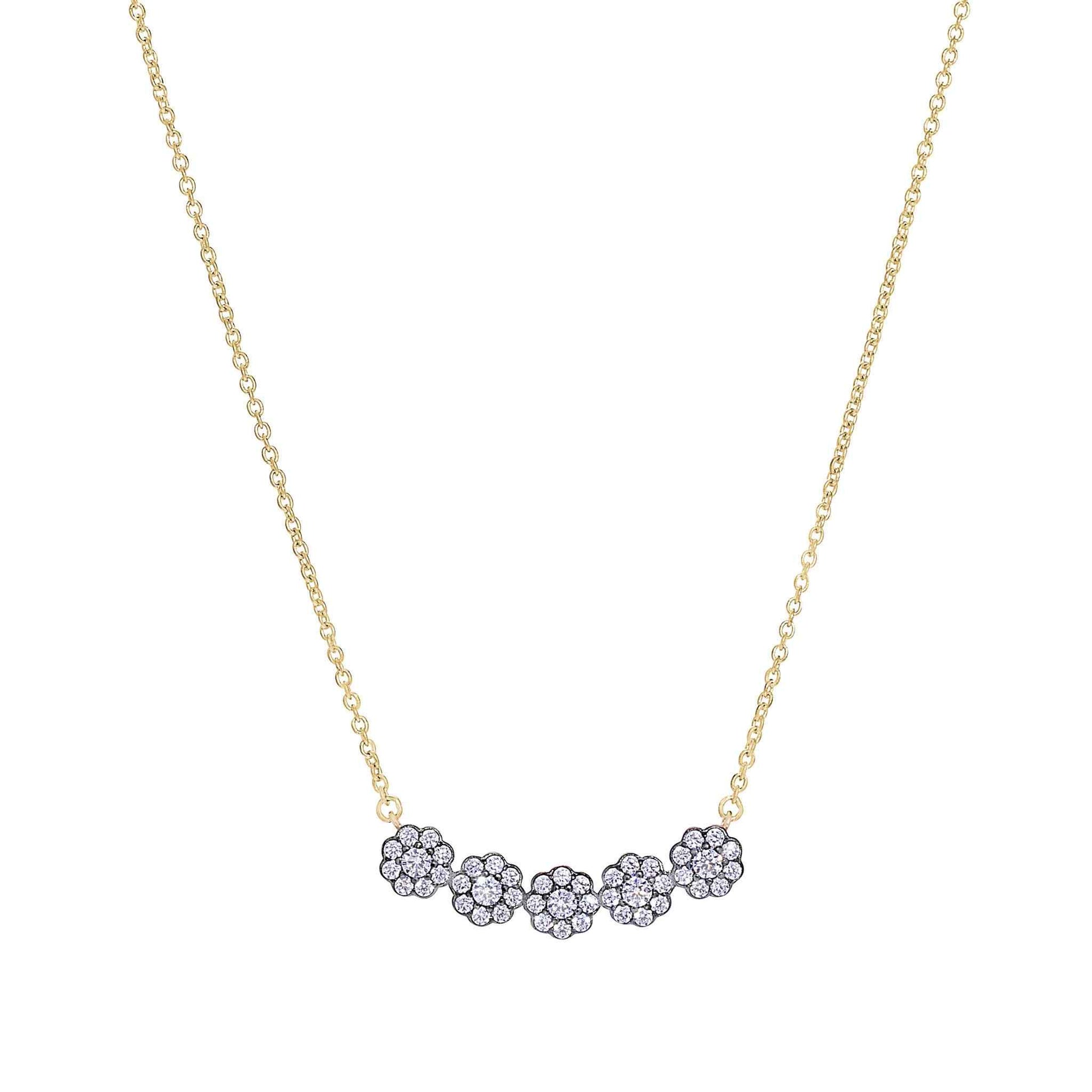 A five round flowers necklace with simulated diamonds displayed on a neutral white background.
