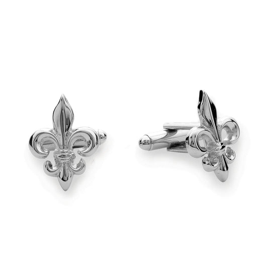 A fleur de lis cufflinks displayed on a neutral white background.