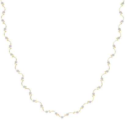 A floating pearl wave necklace displayed on a neutral white background.