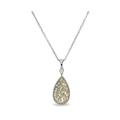 A gold and tear drop necklace with simulated diamonds displayed on a neutral white background.