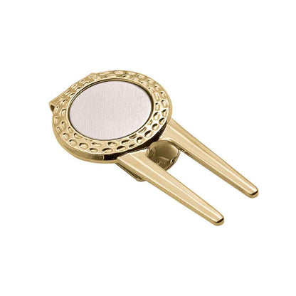 A golf divot repair tool money clip with ball marker displayed on a neutral white background.