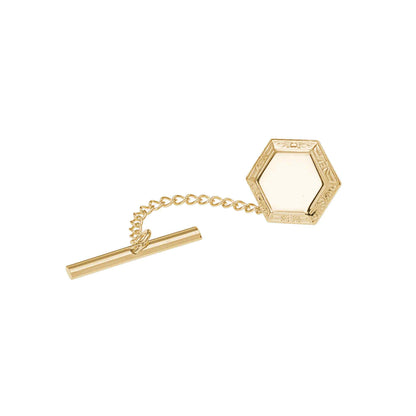 A hexagon tie tack with filigree edge displayed on a neutral white background.