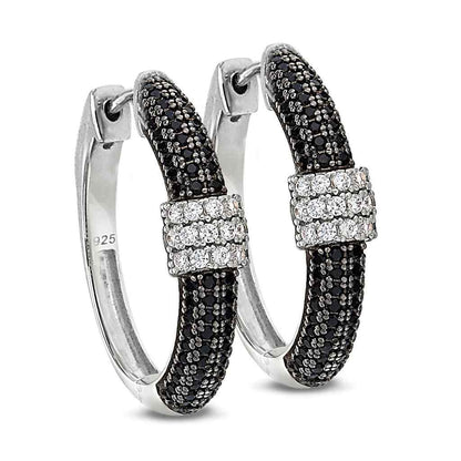 A hoop earrings with black & white simulated diamonds displayed on a neutral white background.
