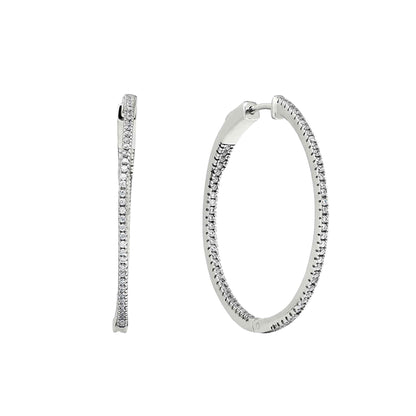 A inside out large hoop earrings with simulated diamonds displayed on a neutral white background.