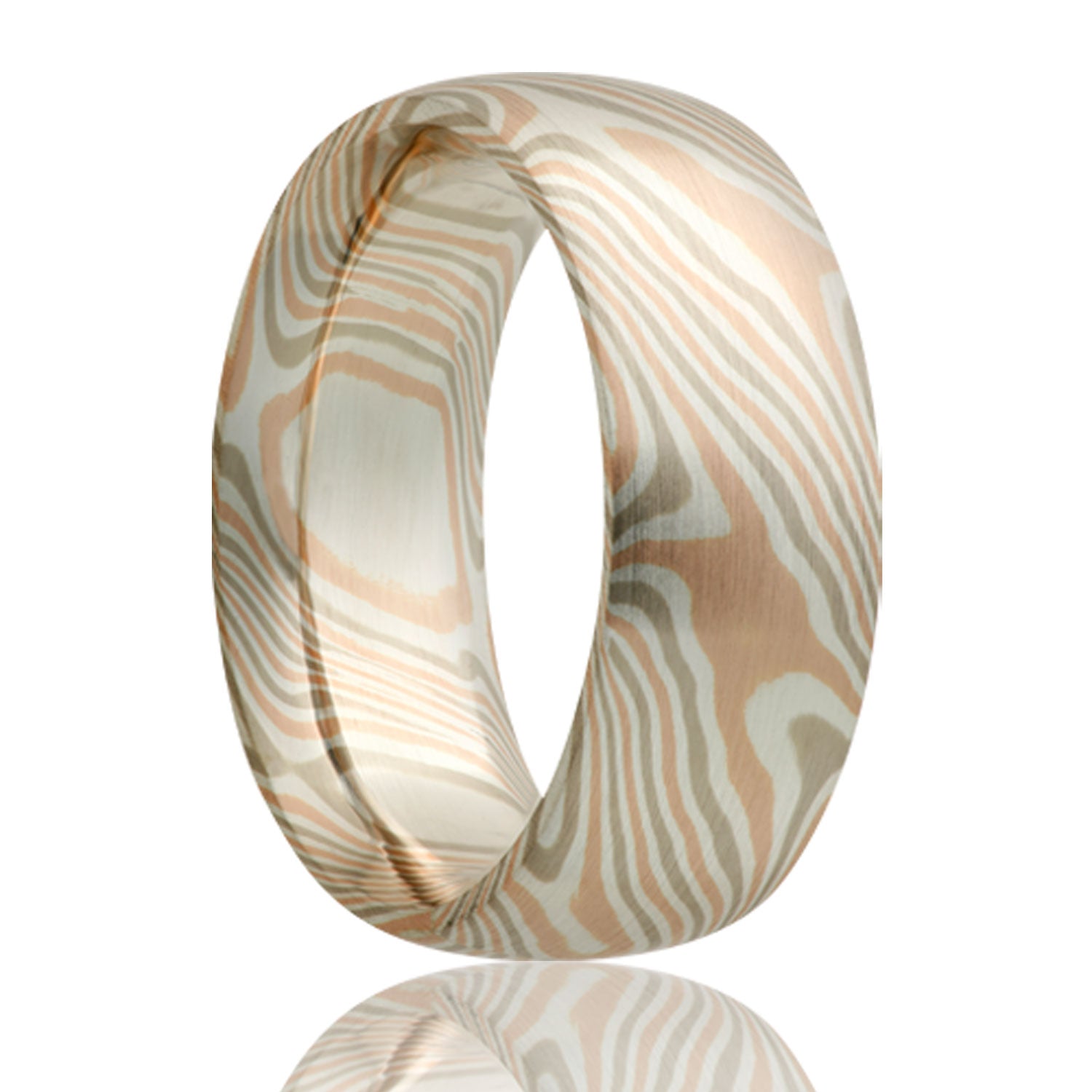 A 14k white & rose gold with sterling silver domed mokume gane wedding band displayed on a neutral white background.
