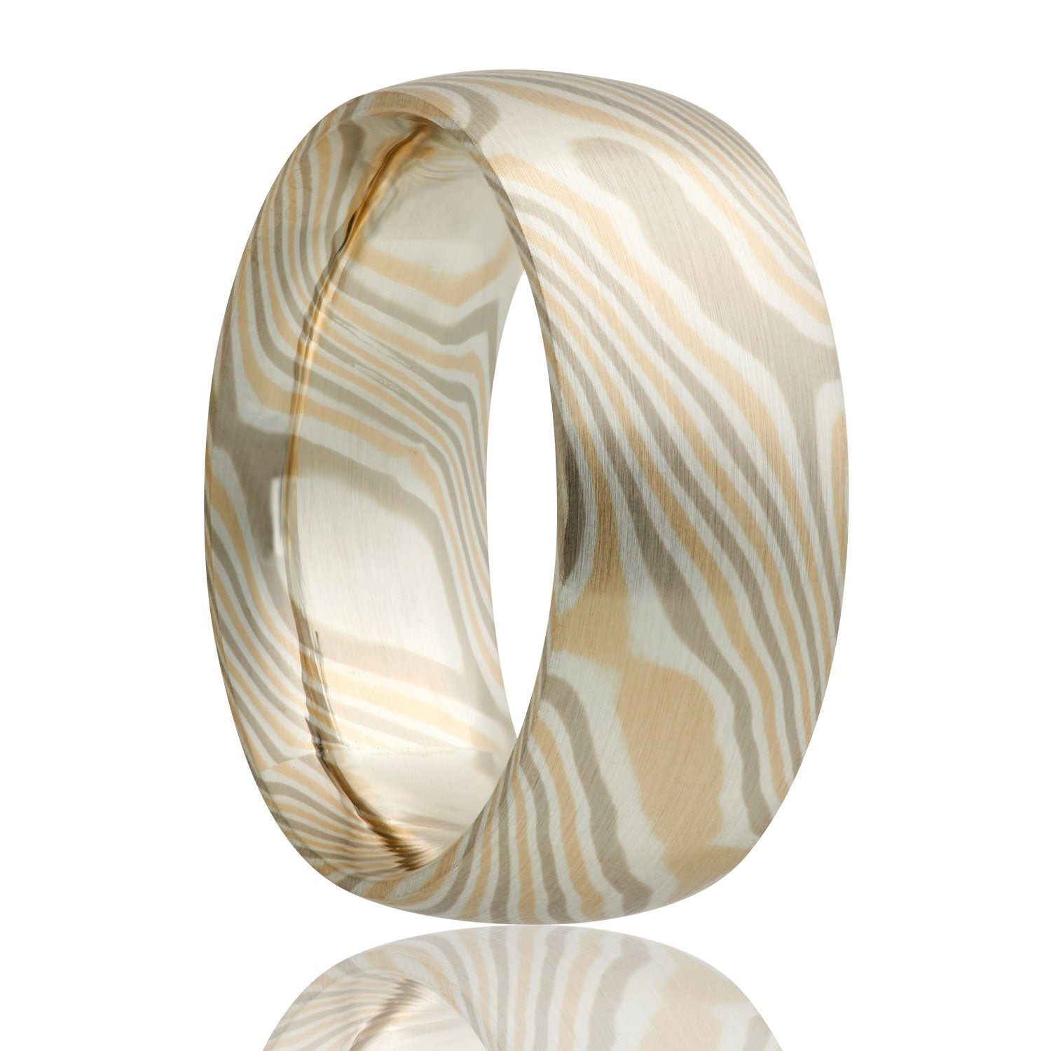 A 14k white & yellow gold with sterling silver domed mokume gane wedding band displayed on a neutral white background.