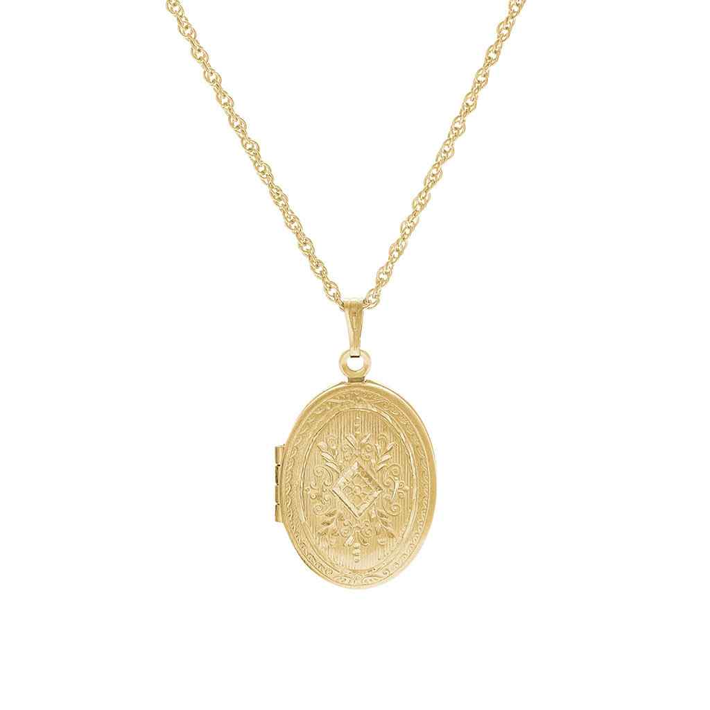 A oval patterned locket with bezel inserts displayed on a neutral white background.