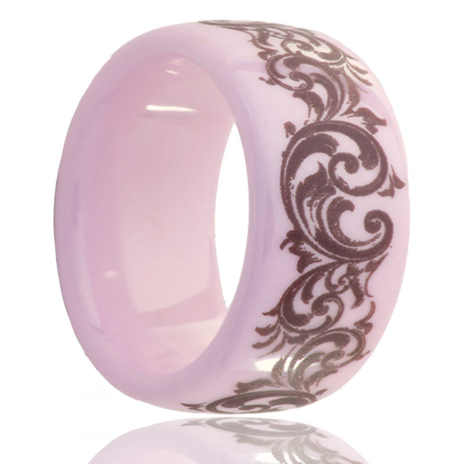 A swirl pattern domed pink ceramic men's wedding band displayed on a neutral white background.