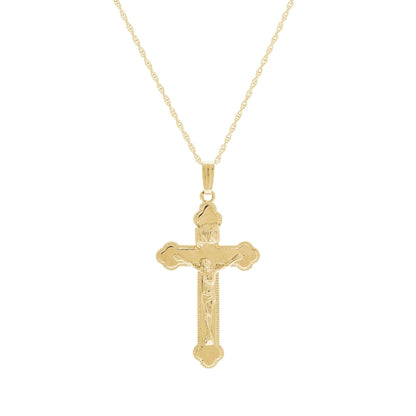 A polished crucifix necklace displayed on a neutral white background.