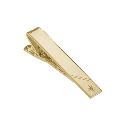 A polished florentine finish tie bar with .01ctw genuine diamond displayed on a neutral white background.