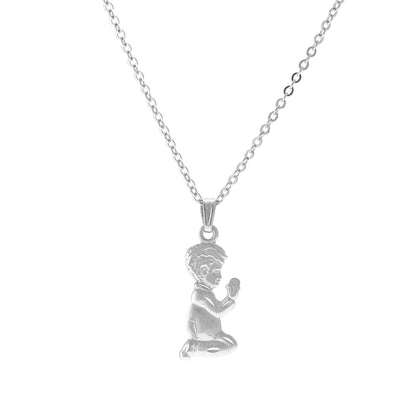 A praying child necklace displayed on a neutral white background.