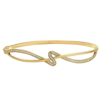 A ribbon swirl bangle bracelet with simulated diamonds displayed on a neutral white background.