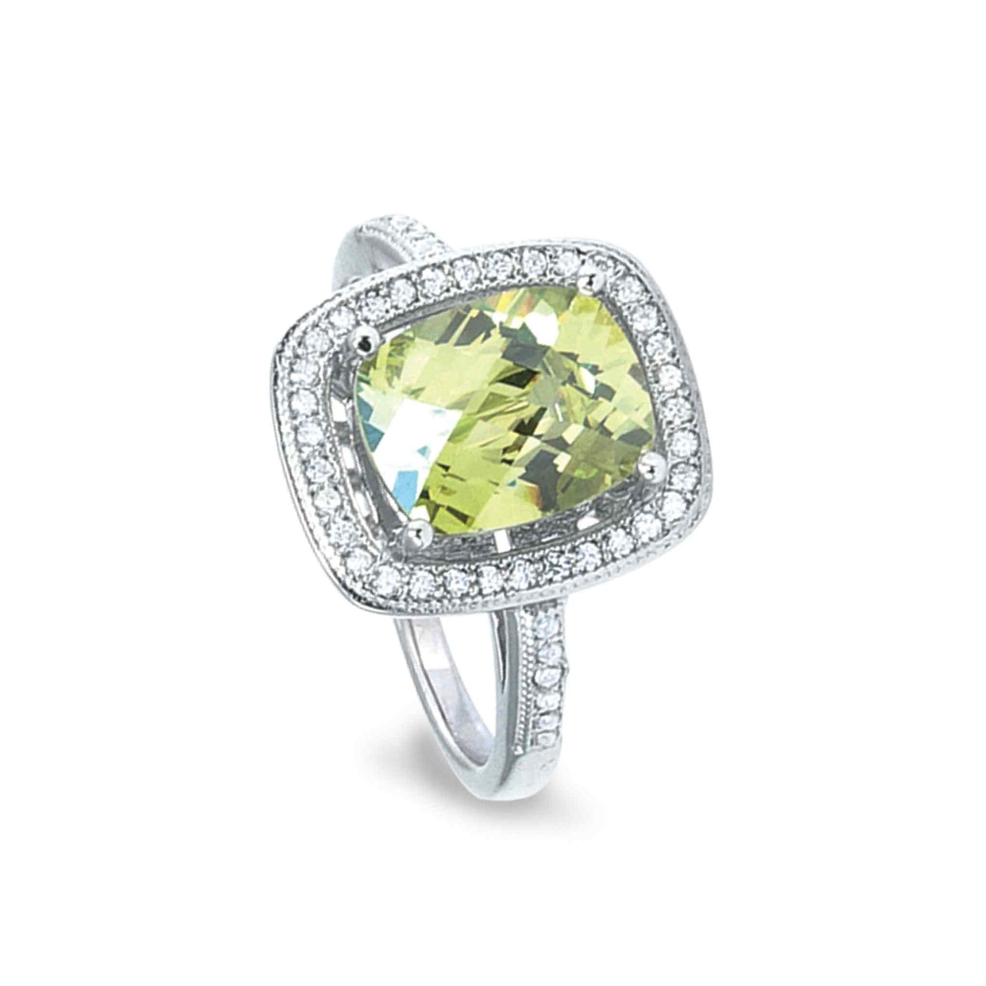 A ring with simulated peridot and simulated diamonds displayed on a neutral white background.