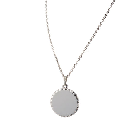 A round necklace with scalloped edge displayed on a neutral white background.