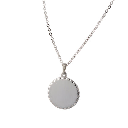 A round necklace with scalloped edge displayed on a neutral white background.