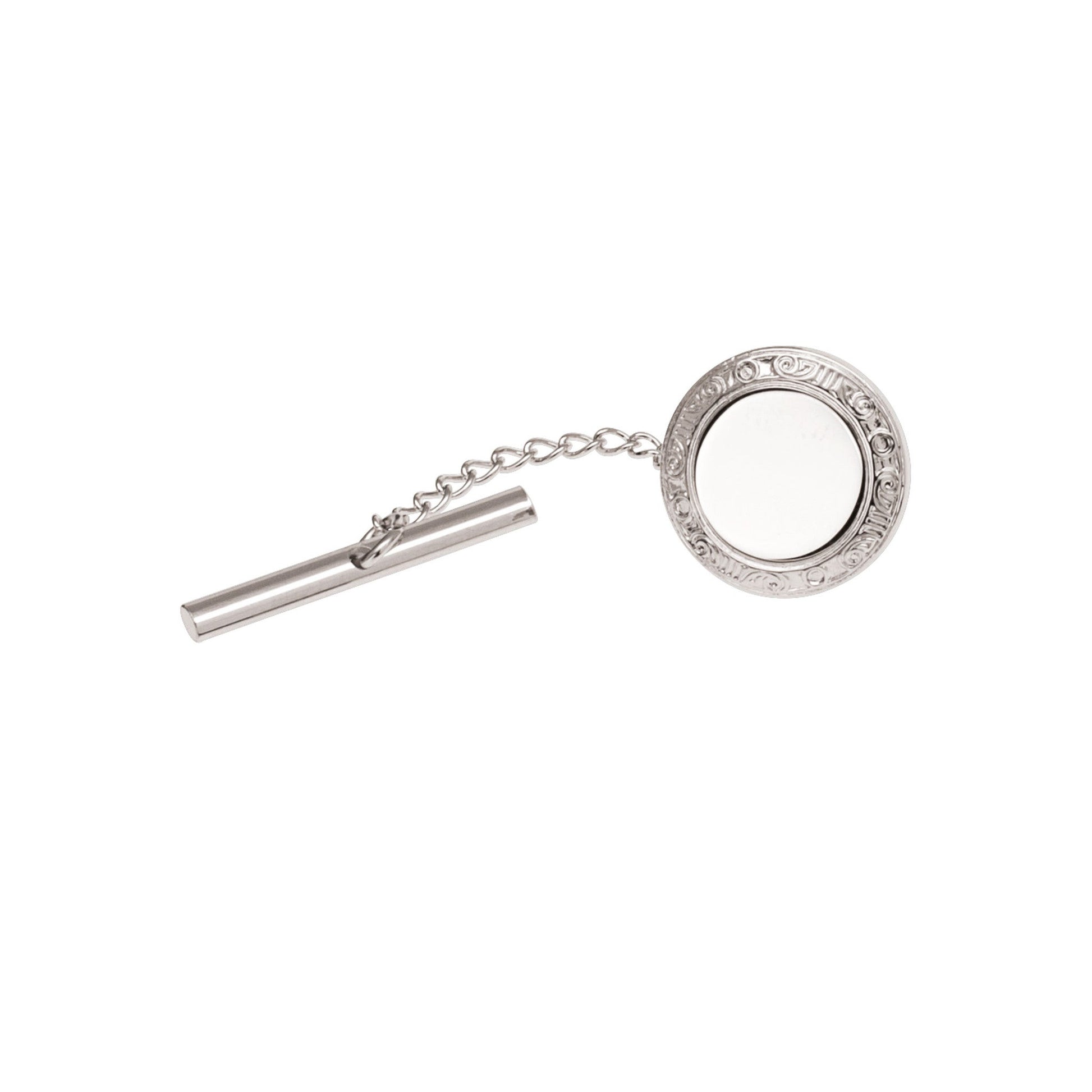 A round tie tack with filigree edge displayed on a neutral white background.