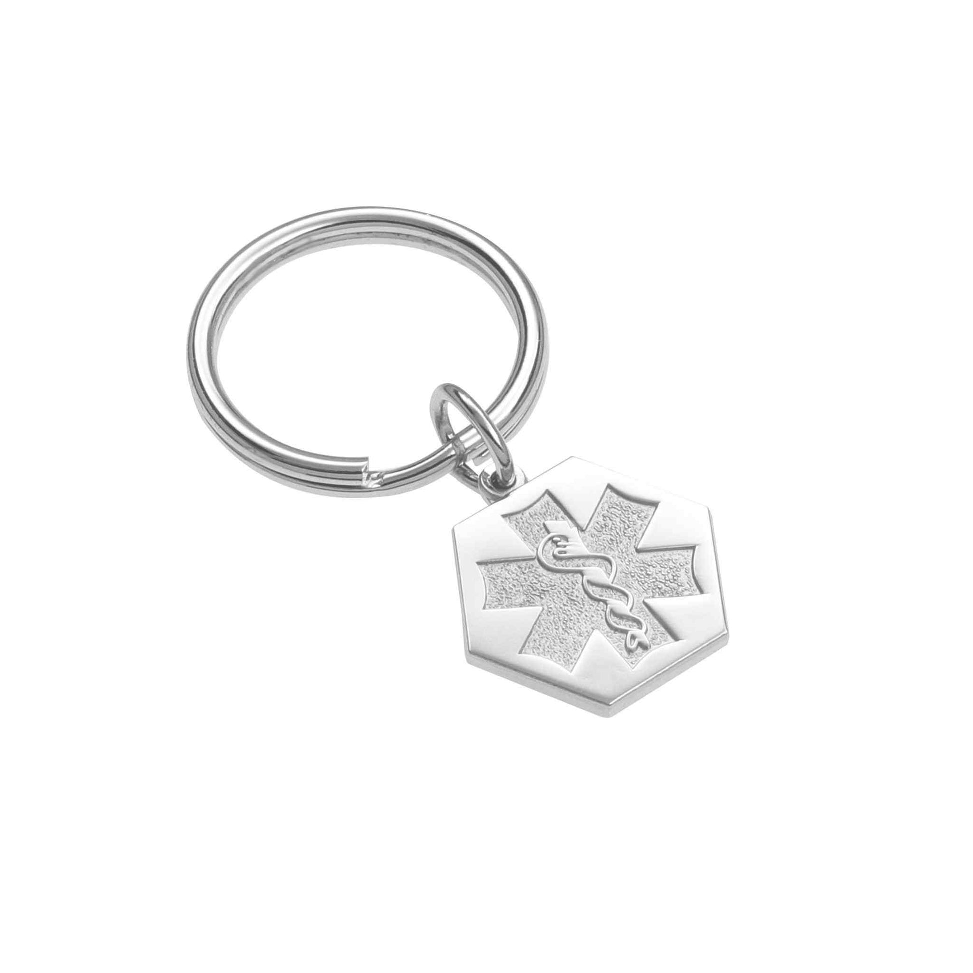 A sandblasted medical symbol key ring displayed on a neutral white background.
