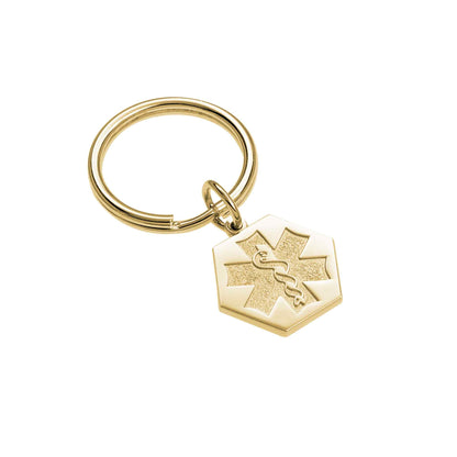 A sandblasted medical symbol key ring displayed on a neutral white background.