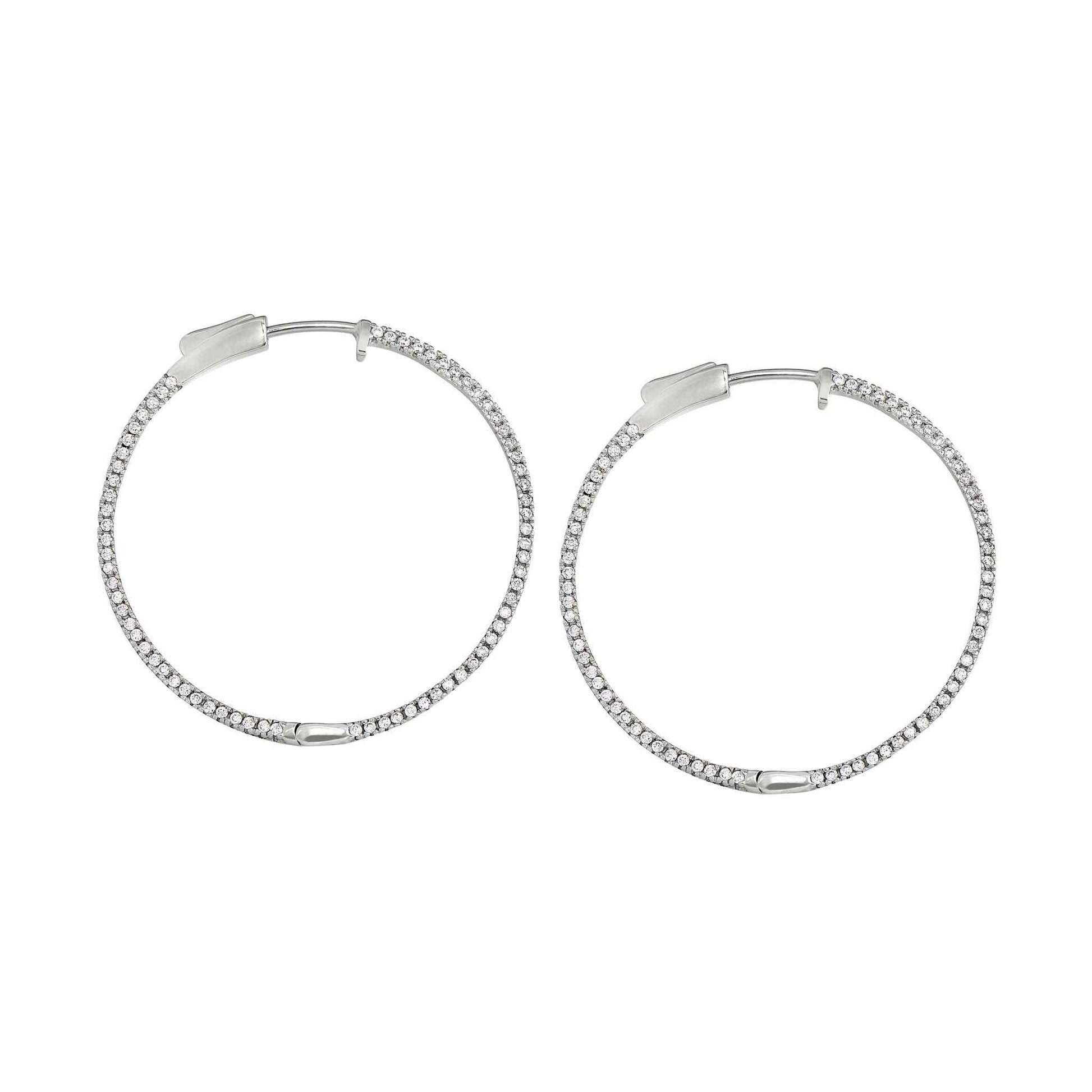 A side stone large hoop earrings with simulated diamonds displayed on a neutral white background.