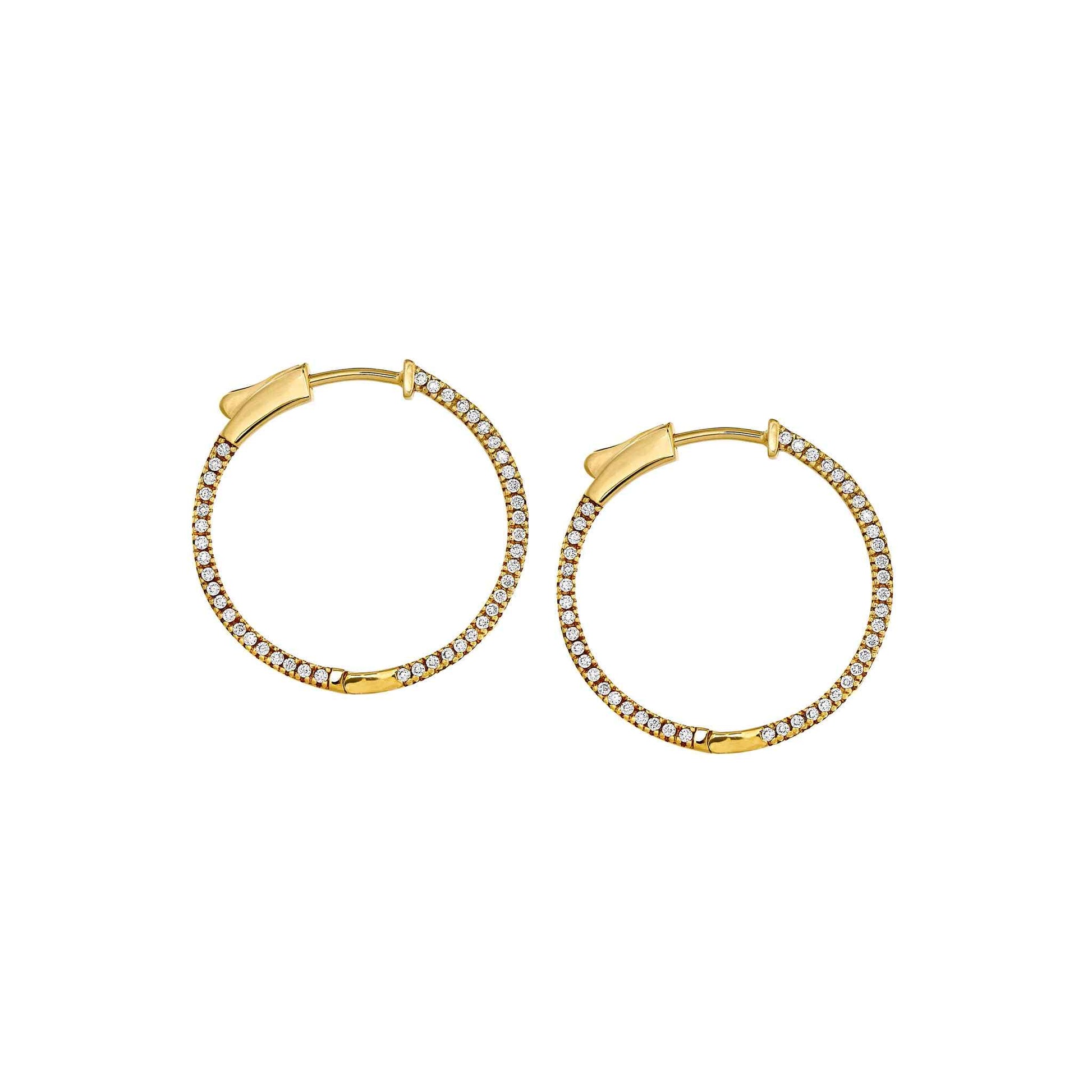 A side stone medium hoop earrings with simulated diamonds displayed on a neutral white background.
