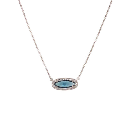 A simulated blue topaz & diamonds oblong necklace displayed on a neutral white background.
