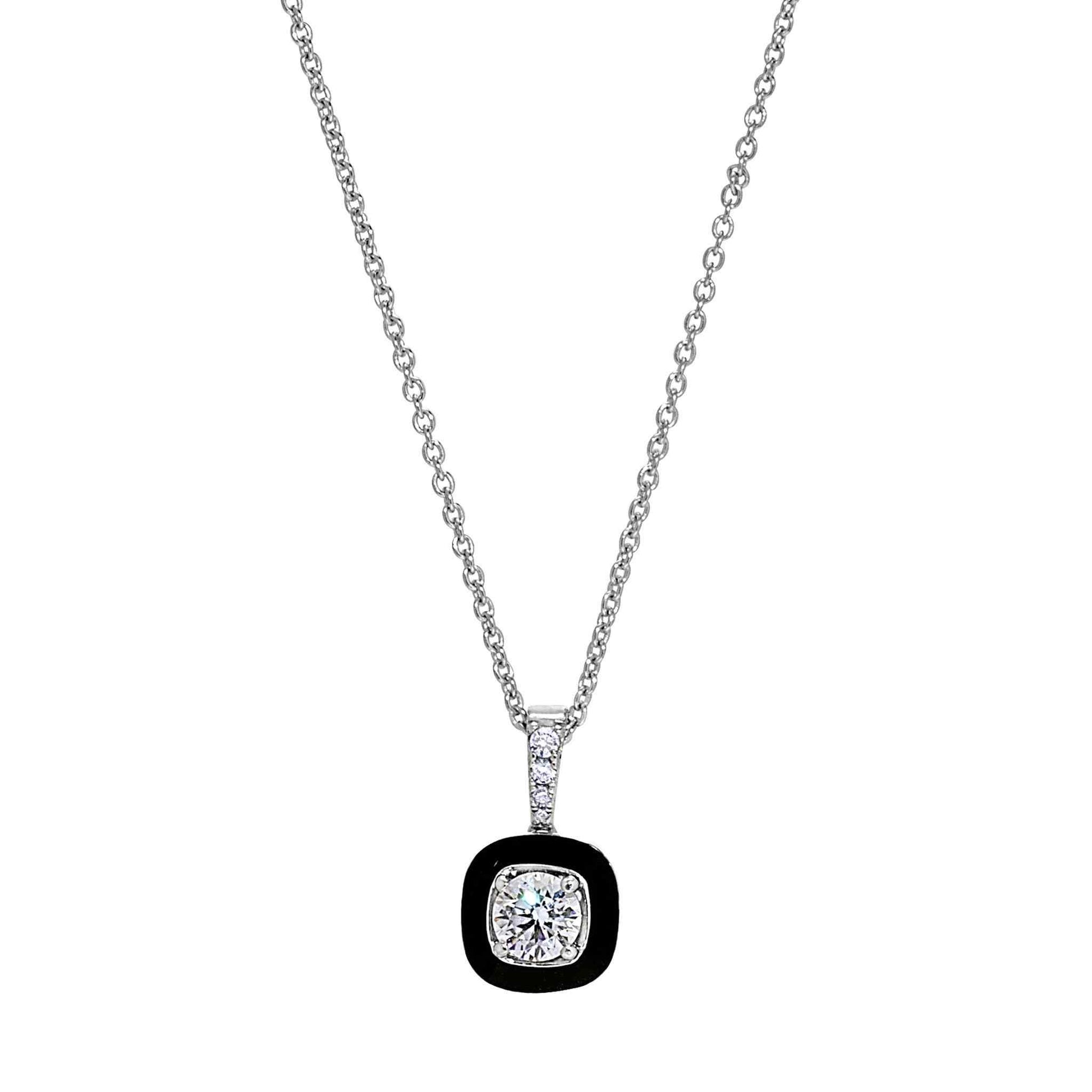 A small cushion cut necklace with black enamel and simulated diamonds displayed on a neutral white background.