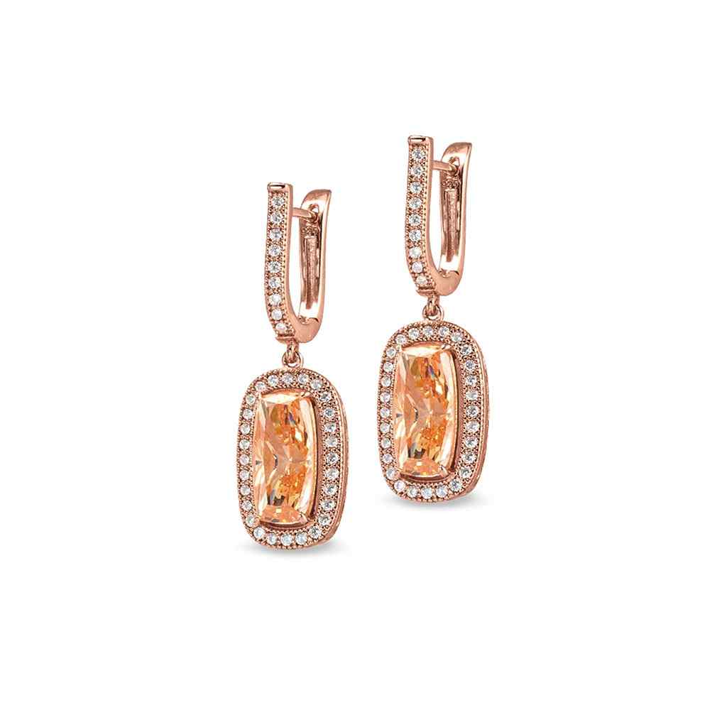 A sterling silver earrings with light champagne colored stone and simulated diamonds displayed on a neutral white background.