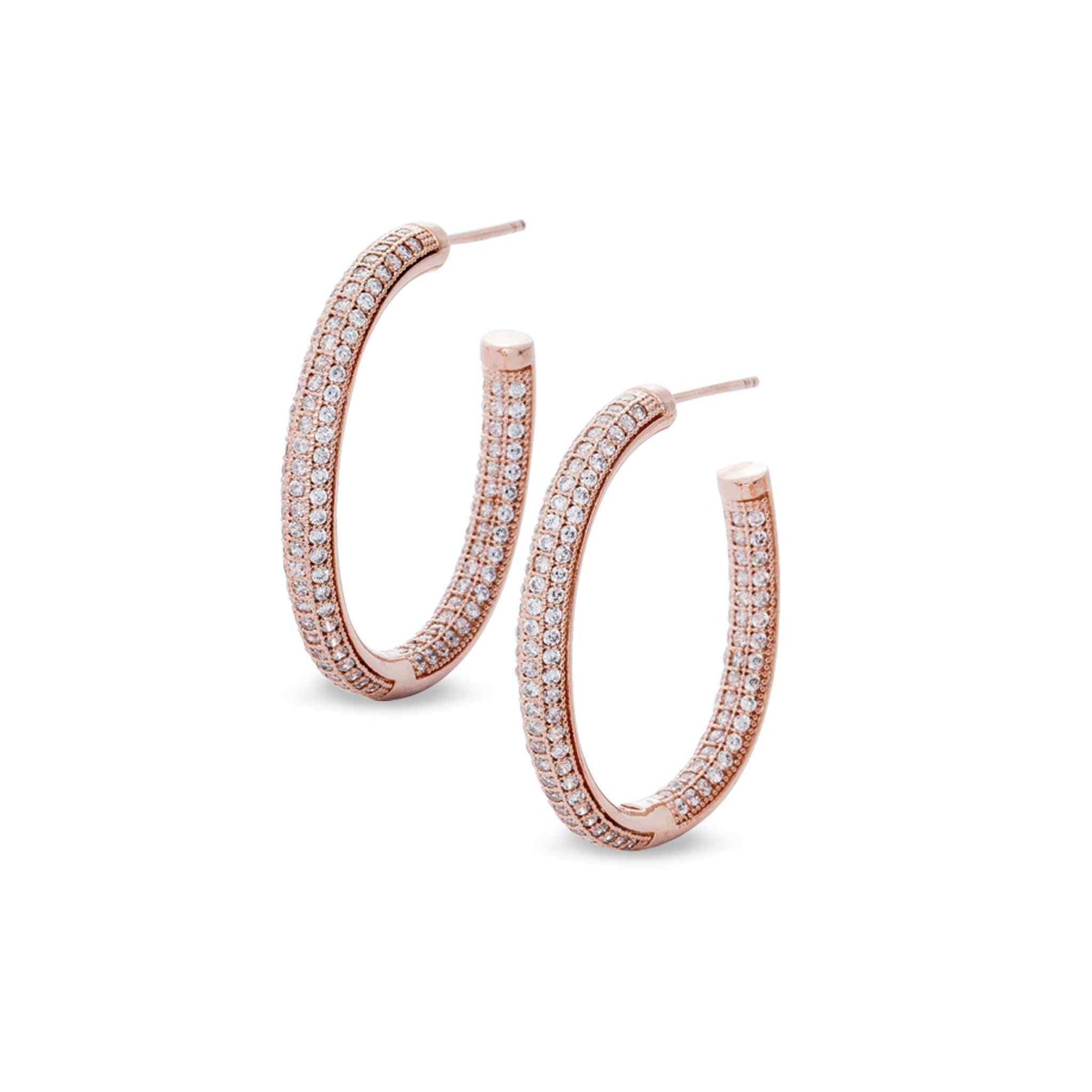 A sterling silver oval inside out hoop earrings with 294 simulated diamonds displayed on a neutral white background.