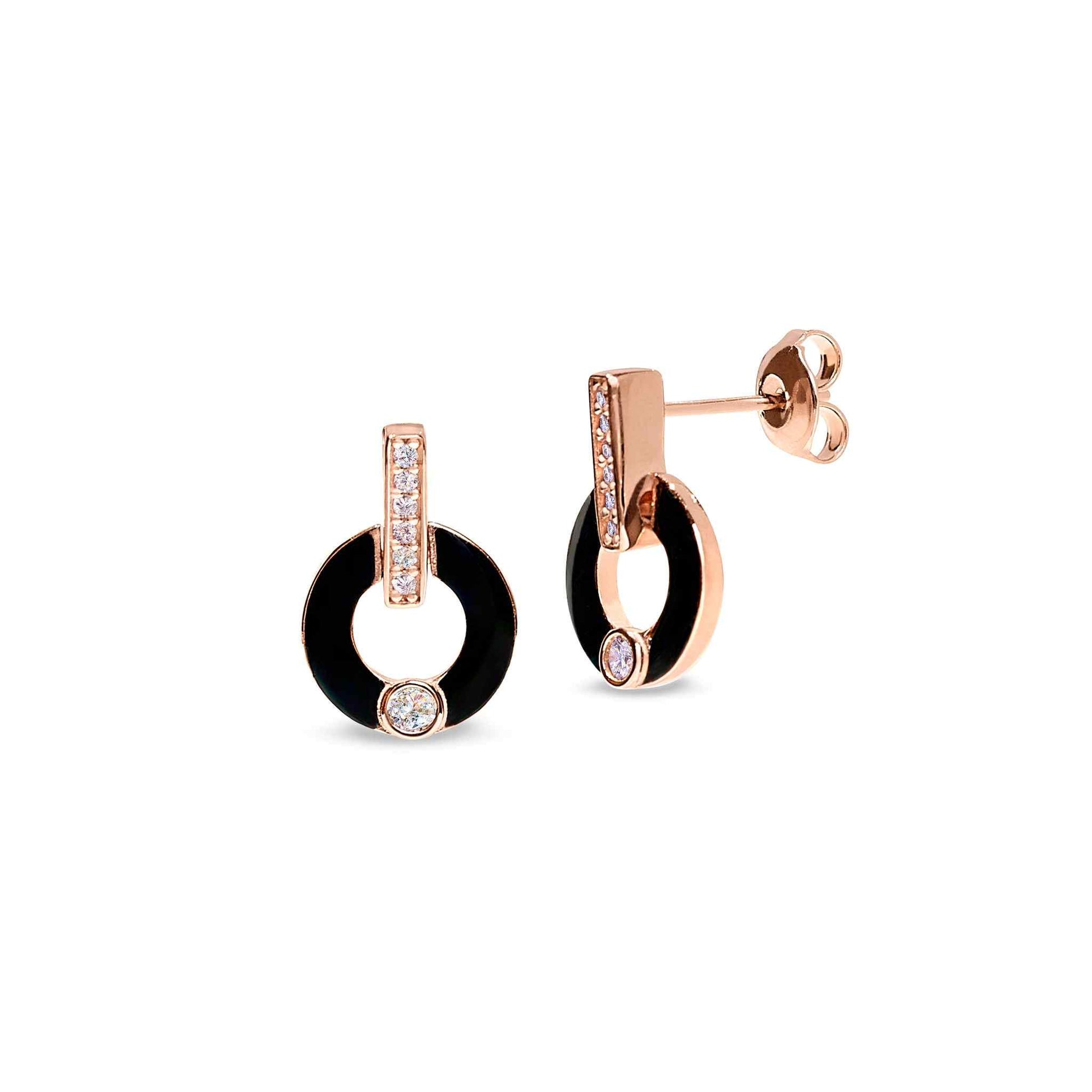 A sterling silver round drop earrings with black enamel and simulated diamonds displayed on a neutral white background.