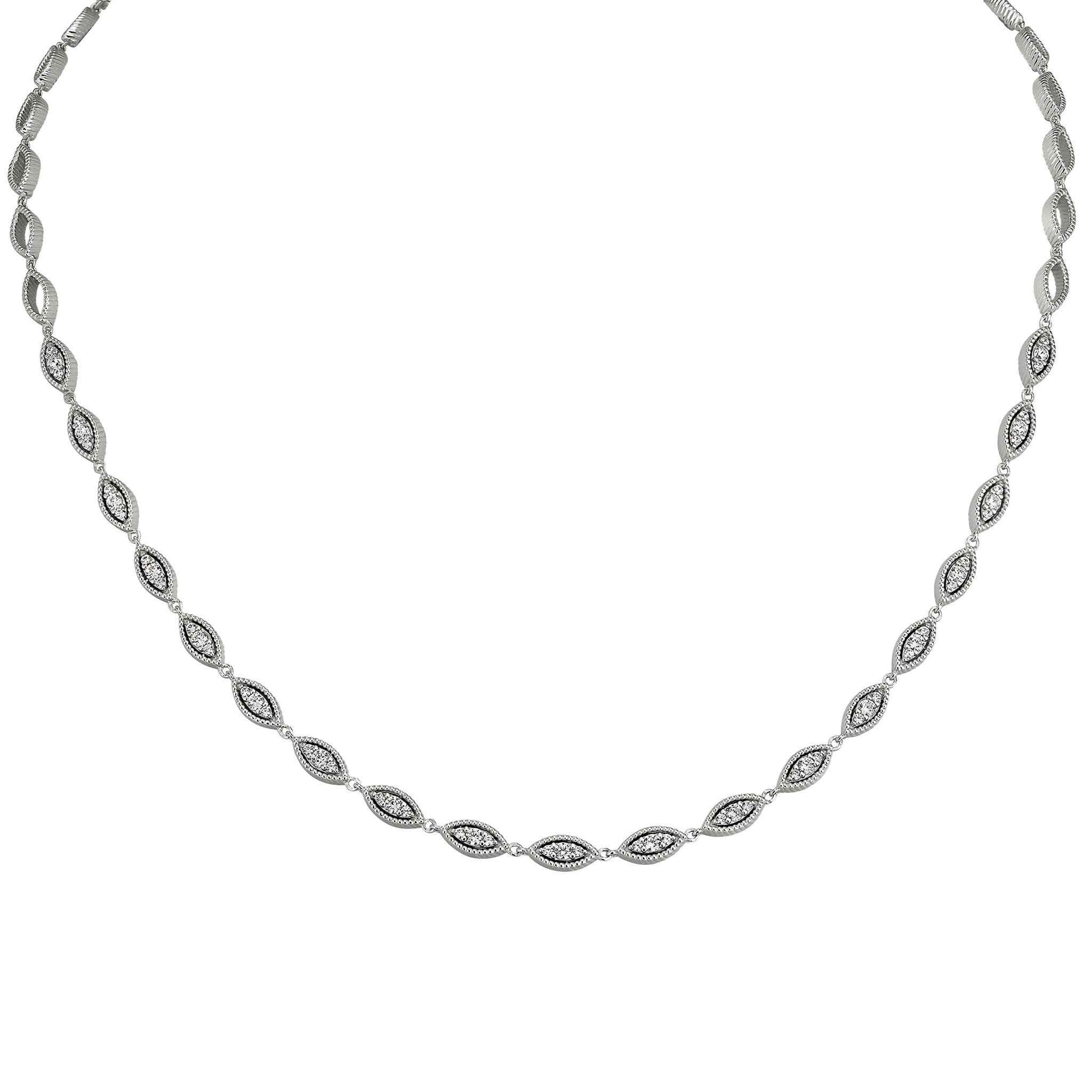 A sterling silver three stone marquise with simulated diamonds displayed on a neutral white background.