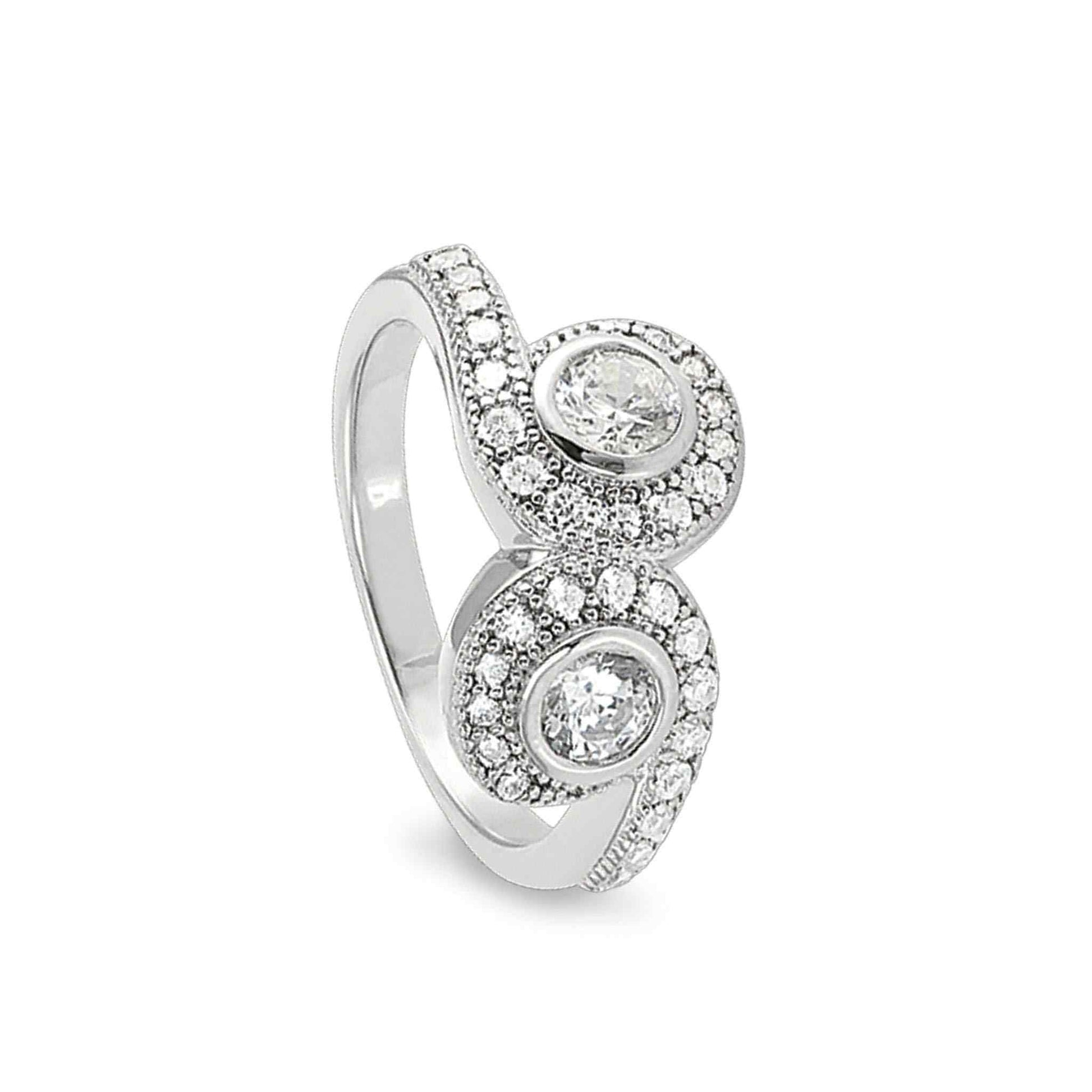 A swirl two stone ring with two 120 facet simulated diamonds displayed on a neutral white background.