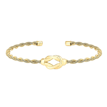 A twisted cable bracelet with open knot displayed on a neutral white background.