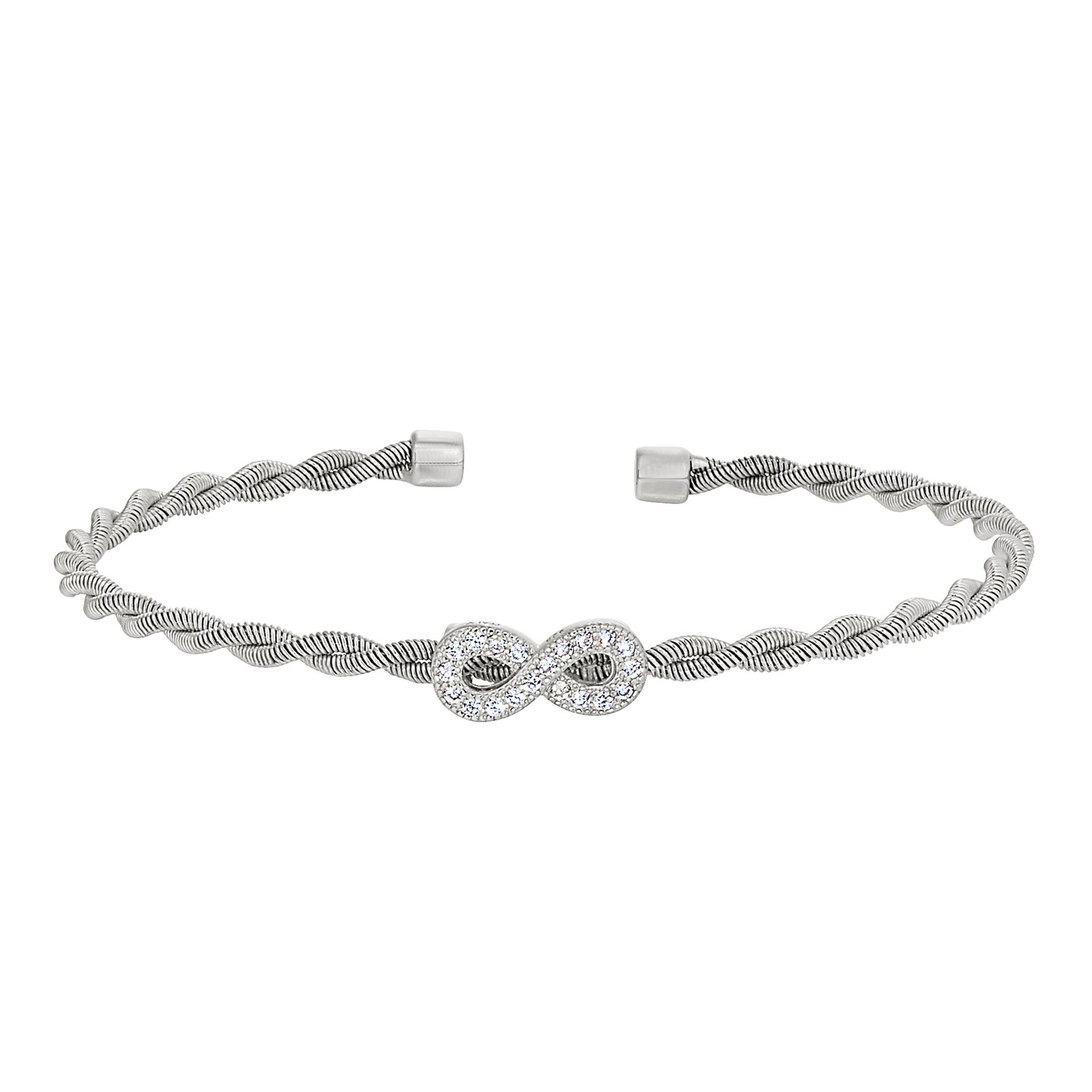 A infinity symbol twisted flexible cable bracelet with simulated diamonds displayed on a neutral white background.