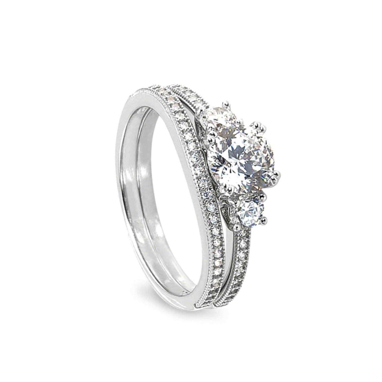 A three stone wedding ring set with 100facet simulated diamond displayed on a neutral white background.