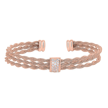 A cubic zirconia accented twisted three cable bracelet displayed on a neutral white background.