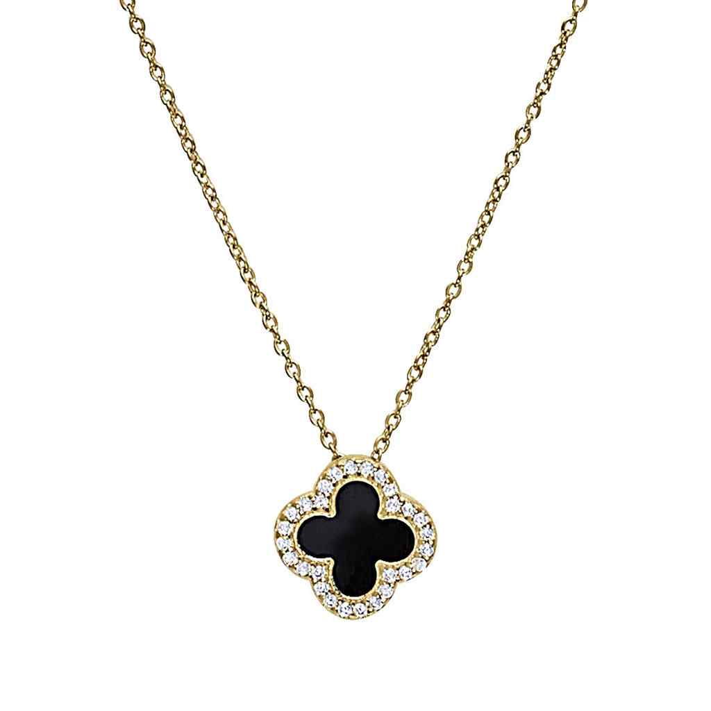 A turquoise enamel clover necklace with simulated diamonds displayed on a neutral white background.