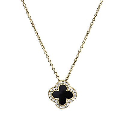 A turquoise enamel clover necklace with simulated diamonds displayed on a neutral white background.