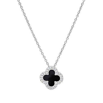 A turquoise enamel clover necklace with simulated diamonds displayed on a neutral white background.