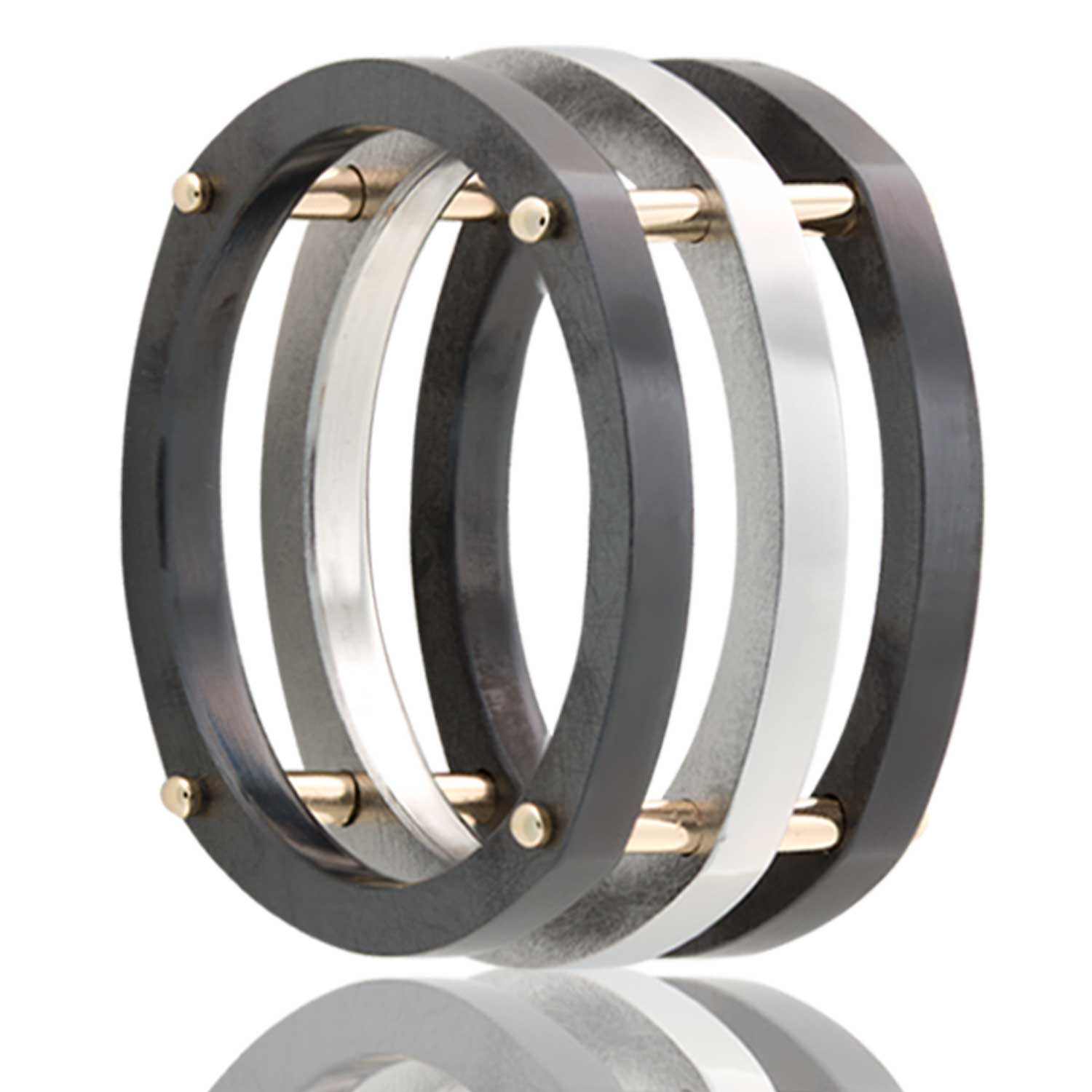 A zirconium men's wedding band with gold bars displayed on a neutral white background.